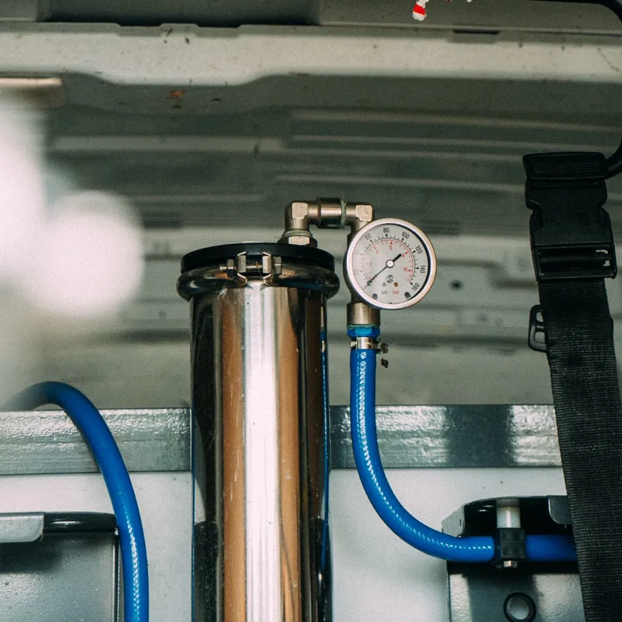 Pure water filtration vessel and pressure gauge inside the van